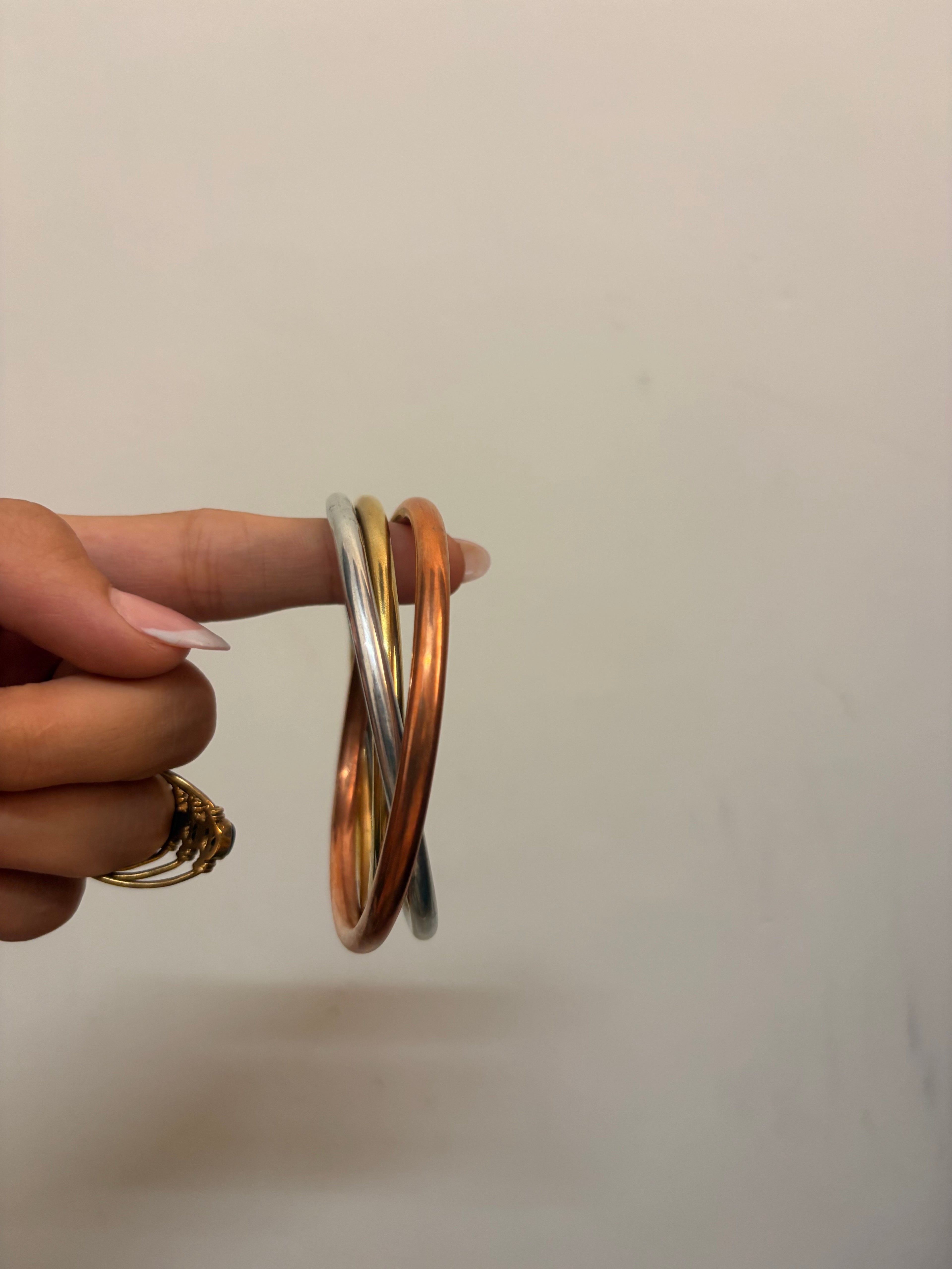 Intertwined brass bangle