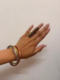 Interlocked brass bangles