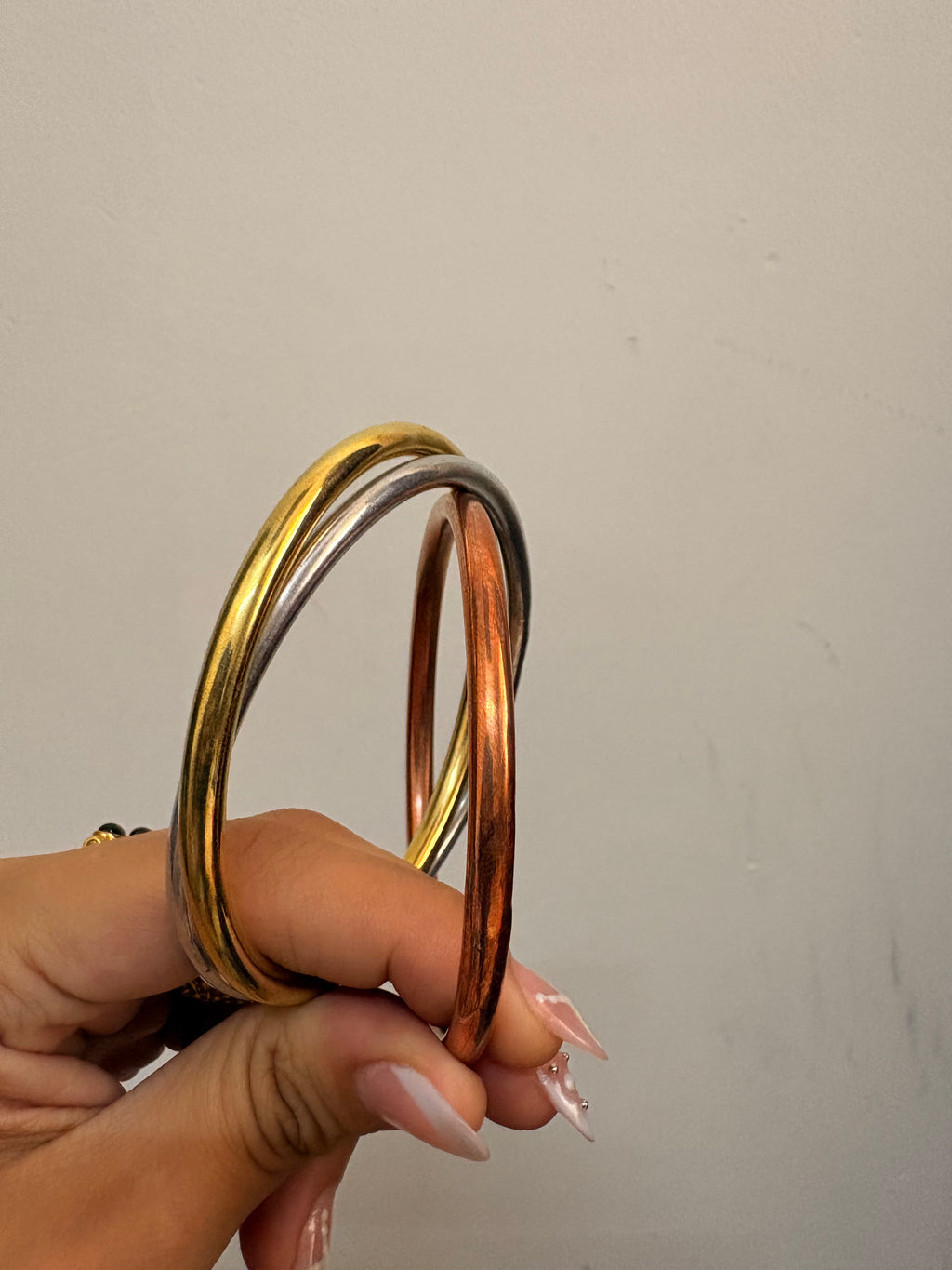 Intertwined brass bangle